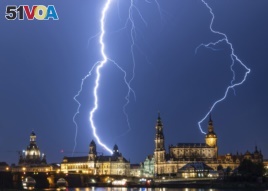 Lightning strikes across the sky in Dresden, Germany, Monday, June 10, 2019. (Robert Michael/dpa via AP)
