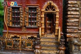 A miniature brownstone building is displayed during preparations for the annual Holiday Train Show in New York City, November 11, 2021.