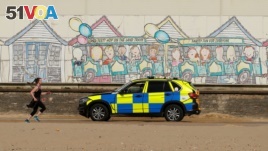 Police are seen on Bournemouth beach, as the spread of the coronavirus disease (COVID-19) continues, Bournemouth, Britain, April 5, 2020.