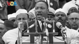 Dr. Martin Luther King, Jr. addresses marchers during his 