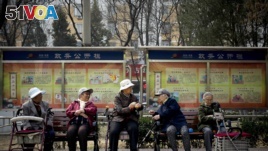 A group of elderly women rest in their wheelchairs at a residential compound in Beijing, China.