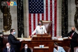 U.S. Speaker of the House Nancy Pelosi (D-CA) wields her gavel ahead of the final passage in the House of Representatives of U.S. President Joe Biden's $1.9 trillion coronavirus disease