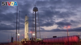 This Tuesday, Oct. 29, 2019 photo made available by NASA shows the Northrop Grumman Antares rocket a few hours after arriving at its launch pad at NASA's Wallops Flight Facility in Virginia. 