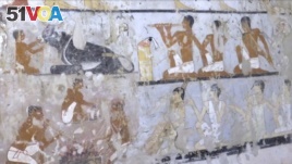 This image taken from video, Feb. 3, 2018, shows wall paintings inside a 4,400-year-old tomb near the pyramids outside Cairo, Egypt.