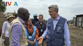UNCHR High Commissioner Filippo Grandi, right, visits South Sudan's largest camp for the internally-displaced, in Bentiu, South Sudan Sunday, June 18, 2017.