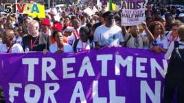 In this file photo, civil rights activists march in Durban, South Africa, July 18, 2016 at the start of the 21st World Aids Conference.
