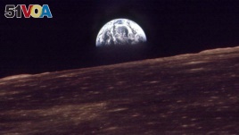 FILE - The Earth shines over the horizon of the Moon in this Dec. 24, 1968, photo shot by the astronauts on Apollo 8. (NASA)