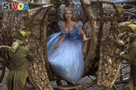 Cinderella wears a beautiful gown as steps out of her coach.