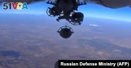 The Russian Defense Ministry says Russian aircraft dropped bombs on Islamic State positions in Syria. 