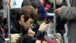 In 2012, South Korea's government estimated that 2.55 million people are addicted to smartphones. (AP Photo/Ahn Young-joon)