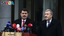 Istanbul Gov. Vasip Sahin, left, accompanied by Police Chief Mustafa Caliskan, talks to the media during a news conference regarding the arrest of a suspect of New Year's nightclub attack in Istanbul, Jan. 17, 2017.