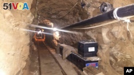 Mexico's Federal Police shows an underground tunnel that police say was built to smuggle drugs from Tijuana, Mexico to San Diego in the United States, October 21, 2015.