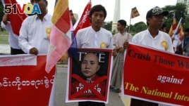 FILE - People demonstrate against Time magazine in Yangon June 30, 2013 when its cover story dubbed radical Buddhist monk U Wirathu, 