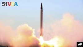 This file picture released by the official website of the Iranian Defense Ministry on Sunday, Oct. 11, 2015, claims to show the launching of an Emad long-range ballistic surface-to-surface missile in an undisclosed location.