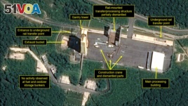 This July 22, 2018, satellite image released and annotated by 38 North on Monday, July 23, shows what the U.S. research group says is the partial dismantling of the rail-mounted transfer structure, at center, at the Sohae launch site in North Korea. (Airbus Defense & Space/38 North via AP)