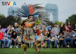 A dancer performs at an Indigenous Peoples' Day Festival in New York, Oct. 2017.