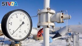 FILE - A gas pressure gauge reads zero on the main gas pipeline from Russia, in the village of Boyarka near the capital Kyiv, Ukraine, Jan. 1, 2009.