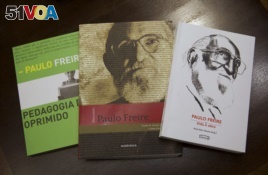 This Feb. 5, 2019 photo shows three books by Paulo Freire at a public library, in Rio de Janeiro, Brazil. (AP Photo/Silvia Izquierdo)