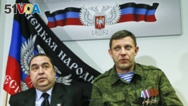 FILE - Alexander Zakharchenko, right, leader of the separatist-controlled area of Donetsk, and Igor Plotnitsky, leader of the separatist-controlled area of Luhansk, attend a news conference in Donetsk, Feb. 2, 2015.