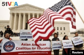 Asian-American demonstrators protest outside the Supreme Court as the affirmative action in university admissions case was being heard by the court in Washington, December 9, 2015. REUTERS/Kevin Lamarque 