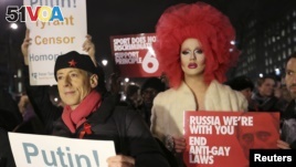 Human rights activist Peter Tatchell (L) protests against Russia's anti-gay stance outside Downing Street, central London February 5, 2014. The protest was held as part of Global Speakout for Russia, which is taking place in more than 30 cities across the