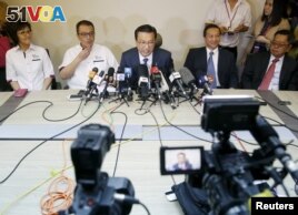 Malaysia's transport minister Liow Tiong Lai speaks at a news conference about debris found on a beach in Mozambique.