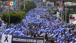 Tens of thousands march against Nicaragua's President Daniel Ortega in Managua, Nicaragua, Wednesday, May 30, 2018. 