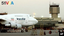 FILE - In this June 2003 file photo, a Boeing 747 of Iran's national airline is seen at Mehrabad International Airport in Tehran. Boeing Co. is negotiating a deal to sell 100 airplanes to Iran, state-run media reported Sunday, June 19, 2016 a sale potentially worth billions that would mark the first major entry of an American company into the Islamic Republic after last year's nuclear deal. (AP Photo/Hasan Sarbakhshian, File)