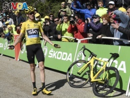 Britain's Chris Froome reacts after he crashed at the end of the twelfth stage of the Tour de France cycling race