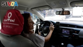 Taxi driver Priscila Galante drives her car in a main street in Sao Paulo, Brazil October 10, 2017. Picture taken October 10, 2017. REUTERS/Paulo Whitaker