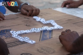 A game of dominoes being played in Colombia.