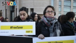 Human rights activists stage a protest demanding the release of Amnesty International's Taner Kilic, outside a court in Istanbul, Turkey. (File)