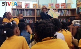 Education Secretary Betsy DeVos reads to students at Eagle Academy Public Charter School in Washington, Friday, June 2, 2017.