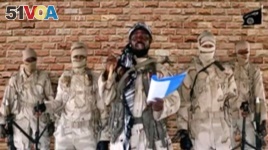 Leader of one of the Boko Haram group's factions, Abubakar Shekau speaks in front of guards in an unknown location in Nigeria in this still image taken from an undated video obtained on Jan. 15, 2018.