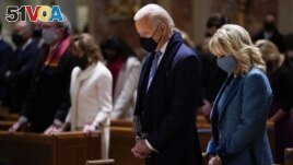  FILE - In this Wednesday, Jan. 20, 2021 file photo, President-elect Joe Biden and his wife, Jill Biden, attend Mass at the Cathedral of St. Matthew the Apostle during Inauguration Day ceremonies in Washington. (AP Photo/Evan Vucci, File)