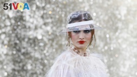 A model wears a creation for the Chanel Spring/Summer 2018 ready-to-wear fashion collection presented in Paris, Tuesday, Oct., 2017. (AP Photo/Francois Mori)