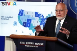 FILE - Dr. Robert Redfield, director of the Centers for Disease Control and Prevention, speaks about the coronavirus in the James Brady Press Briefing Room of the White House, Friday, April 17, 2020, in Washington. (AP Photo/Alex Brandon)