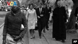 In this June 5, 1966, file photo Sen. Robert F. Kennedy, back right, and his wife, Ethel, back left, arrive at the Roman Catholic Cathedral in Pretoria, South Africa, during a visit to the country. In 1966 Kennedy traveled to apartheid South Africa and spoke about equality and the rule of law. This week members of his family are in democratic South Africa to mark the 50th anniversary of that visit. (AP Photo)