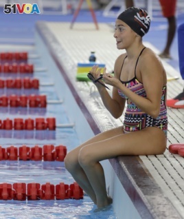 Olympic refugee team member Yusra Mardini prepares to swim laps at the Olympic Aquatics Stadium.
