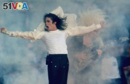 FILE - Michael Jackson performs during the halftime show at the Super Bowl XXVII in Pasadena, California, Jan. 31, 1993.