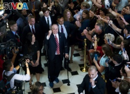 House Republican Whip Steve Scalise walks with his wife Jennifer, left, as he leaves the House chamber in the Capitol.