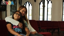 Nury Chavarria, 43, poses with her 9-year-old daughter, Hayley inside Iglesia De Dios Pentecostal church in New Haven, Conn., on Monday, July 24, 2017