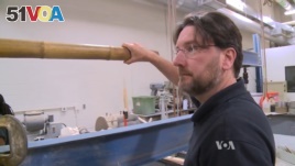 Professor Kent Harries of the University of Pittsburgh is testing bamboo. He wants standardized tests for its use as a building material. (Credit Adam Greenbaum, VOA News)