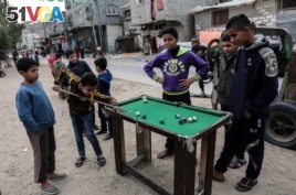 Palestinian boys play pool in the Rafah refugee camp in the southern Gaza Strip.