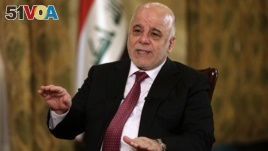 Iraq's Prime Minister Haider al-Abadi speaks during an interview with The Associated Press in Baghdad, Iraq, Sept. 16, 2017. 