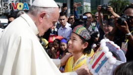 Pope Francis is welcomed as he arrives at Yangon International Airport, Myanmar November 27, 2017. (REUTERS/Max Rossi)