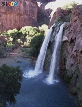 FILE - This 1997 file photo shows one of five waterfalls on Havasu Creek as its waters tumble 210 feet on the Havasupai Tribe's reservation in a southeastern branch of the Grand Canyon near Supai, Ariz.