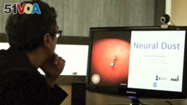 A scientist as the University of California, Berkeley works on the technology called 'neural dust.'