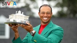 Tiger Woods of the U.S. celebrates with with his green jacket and trophy after winning the 2019 Masters. He was injured in a car accident on February 23, 2021. (REUTERS/Lucy Nicholson) 