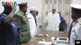 Nigerian President Muhammadu Buhari presides at a meeting with his nation's service chiefs in Abuja, June 2, 2015. (AP Photo/Bayo Omoboriowo)